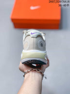 Rear view of a white Nike Journey Run sneaker showing the padded collar and heel structure.
