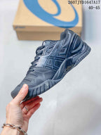 Side view of a dark black and gray ASICS GEL-Resolution 5 tennis shoe showing the logo panels, laces, and textured outsole; image text shows 2607JYD1647A17 and 40–45.
