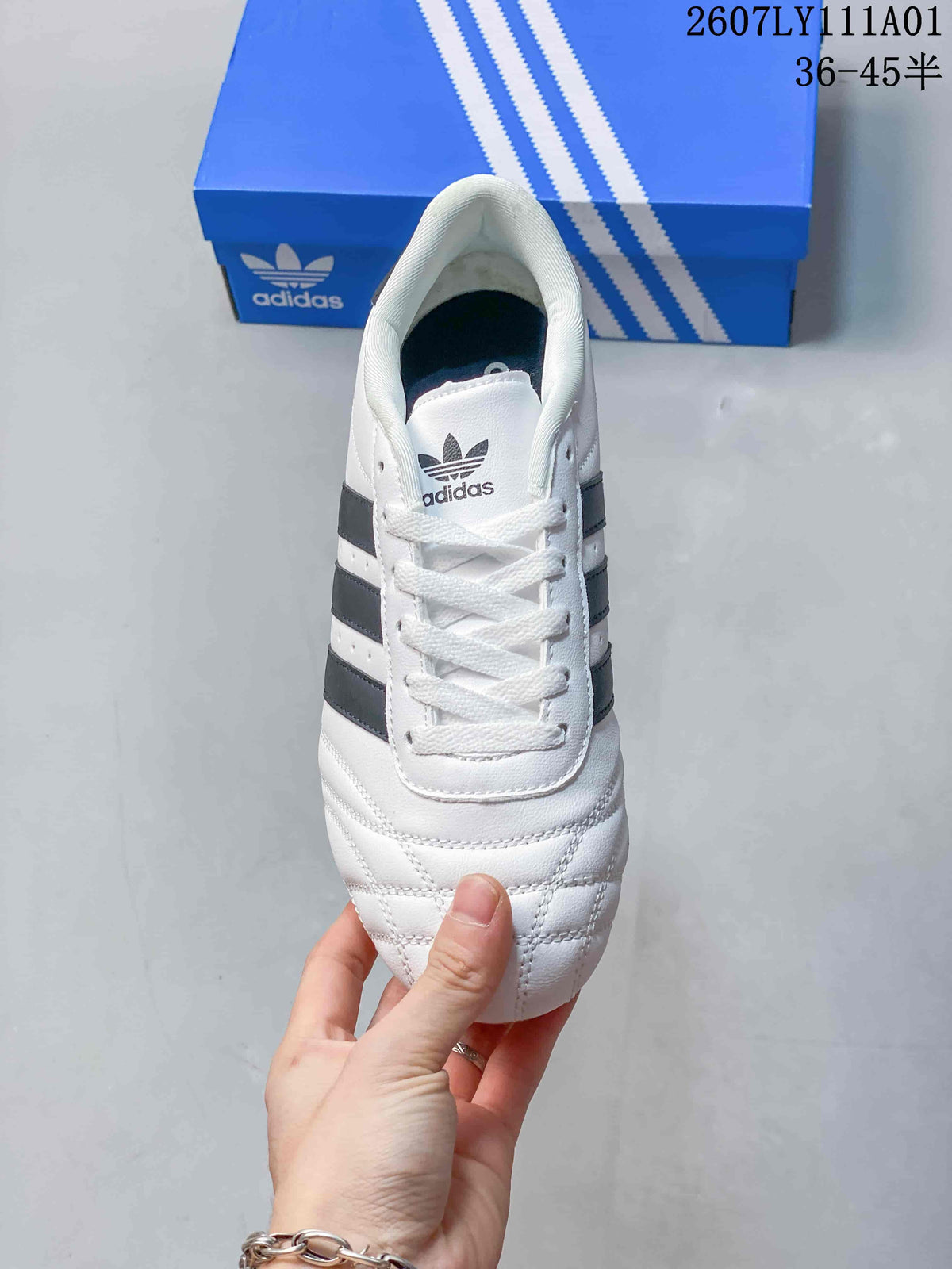 Top view of the lace-up shoe, showing its quilted toe and dark side stripes.