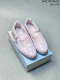 Pair of pearl pink Nike Shox Z Calistra Mary Jane-style sneakers shown on a shoebox.