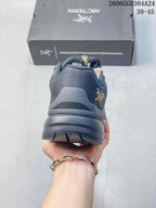 Rear view showing the heel and outsole of a dark gray shoe