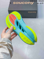 Underside of the Saucony running shoe showing aqua and yellow-green outsole sections