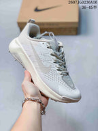 Angled side view showing the Swoosh, lace-up upper, padded collar, white midsole, and lugged outsole.