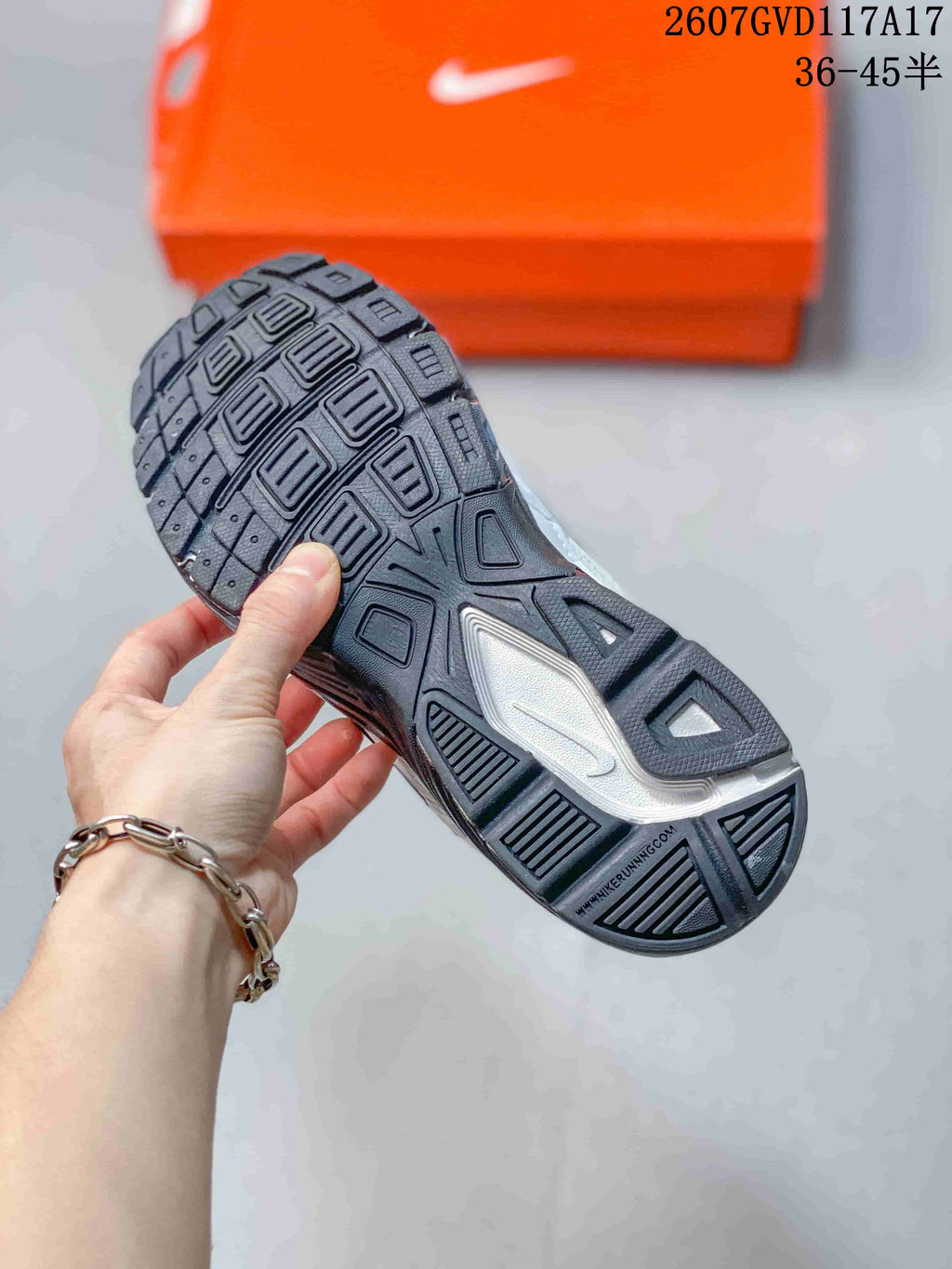 Close-up of the black patterned outsole and tread design of the Nike Initiator sneaker.