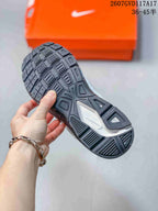 Close-up of the black patterned outsole and tread design of the Nike Initiator sneaker.