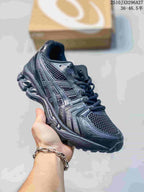 Dark charcoal mesh sneaker with matching overlays and laces