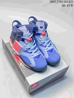 Pair of blue and red high-top Jordan sneakers displayed on a shoe box, with the style code and size range overlaid above.