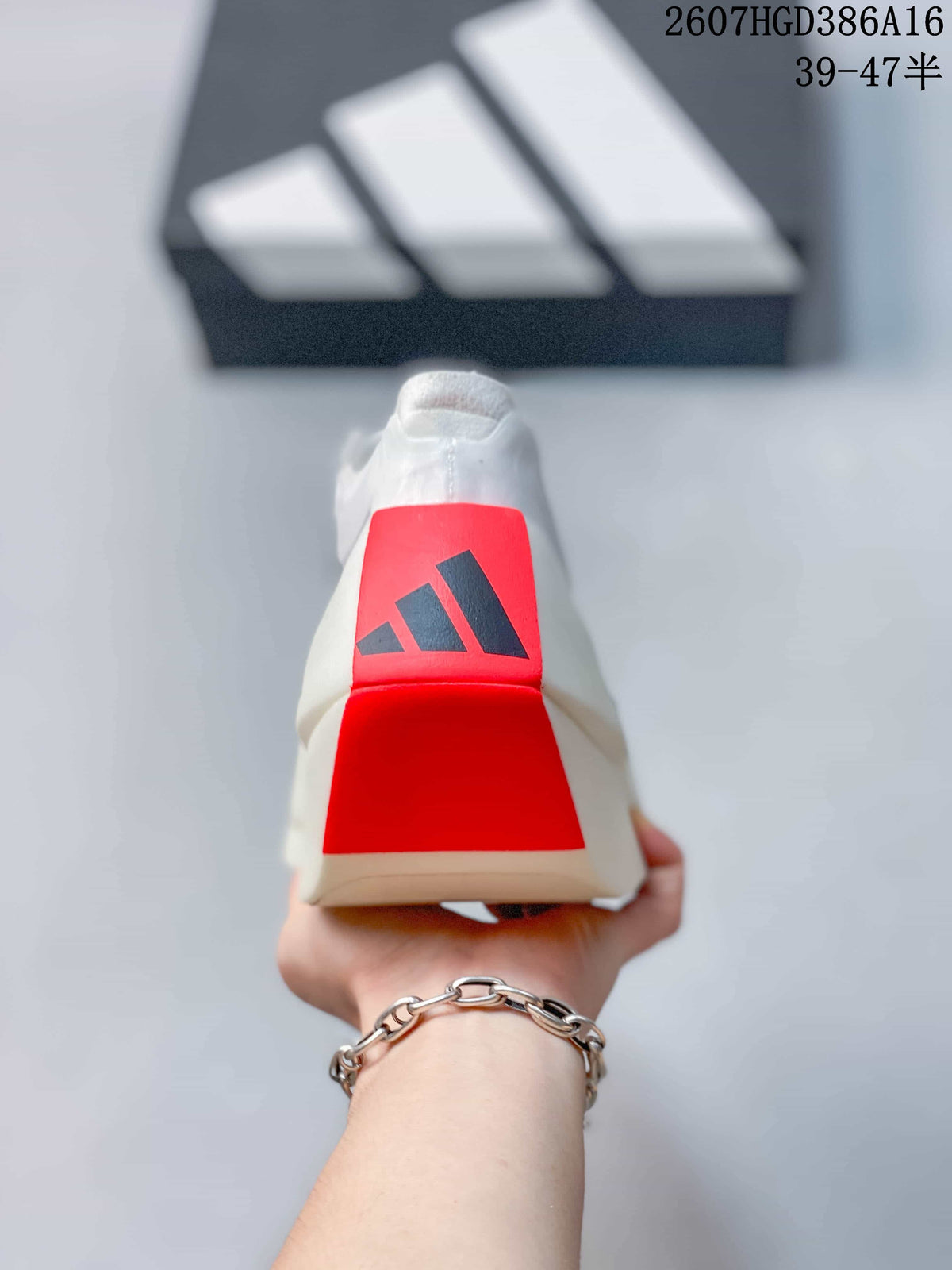 Rear view of the shoe showing the red heel panel and adidas logo.