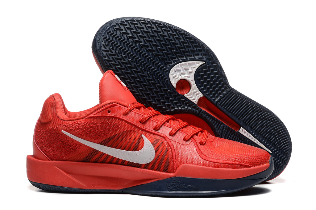 Red Nike Sabrina basketball shoes shown from the side and outsole.