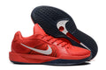 Red Nike Sabrina basketball shoes shown from the side and outsole.