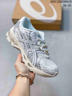 White and silver ASICS Gel-Nimbus 10.1 sneaker with layered panels and a thick cream-toned sole; image text shows style code 2607JHD299A19 and size range 36-45.