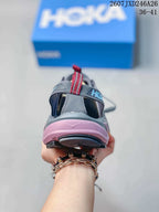 Rear view showing the heel strap, pull tab and layered pink-and-black sole.