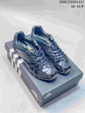 Pair of dark navy Adidas Originals Ghost Sprint sneakers displayed on an Adidas shoebox.
