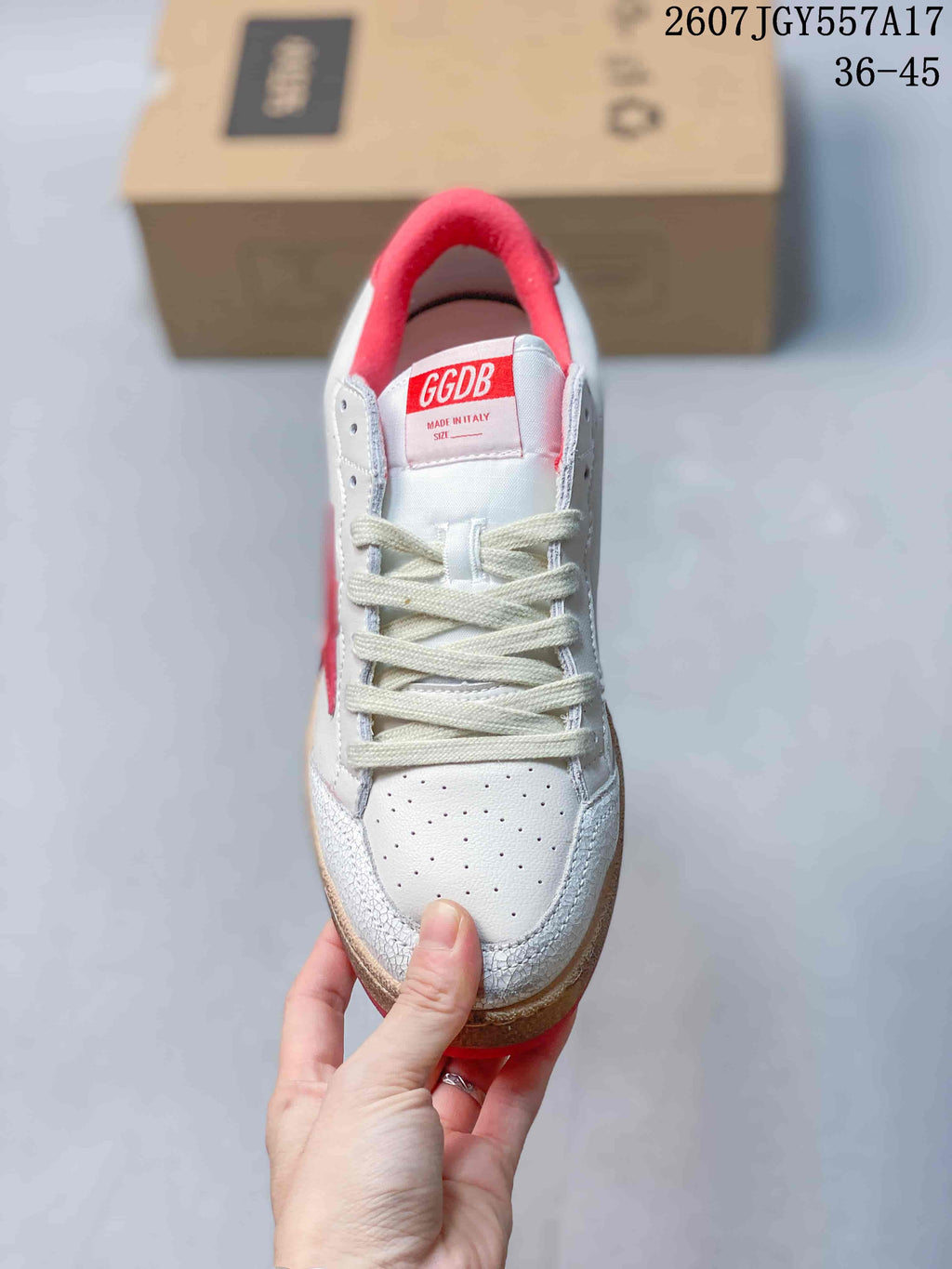 Top view of the sneaker showing the perforated toe box, cream laces, red collar and GGDB tongue label.