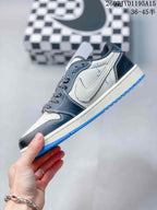 Side profile showing the white side panel, black overlays, blue outsole, and low-top construction.