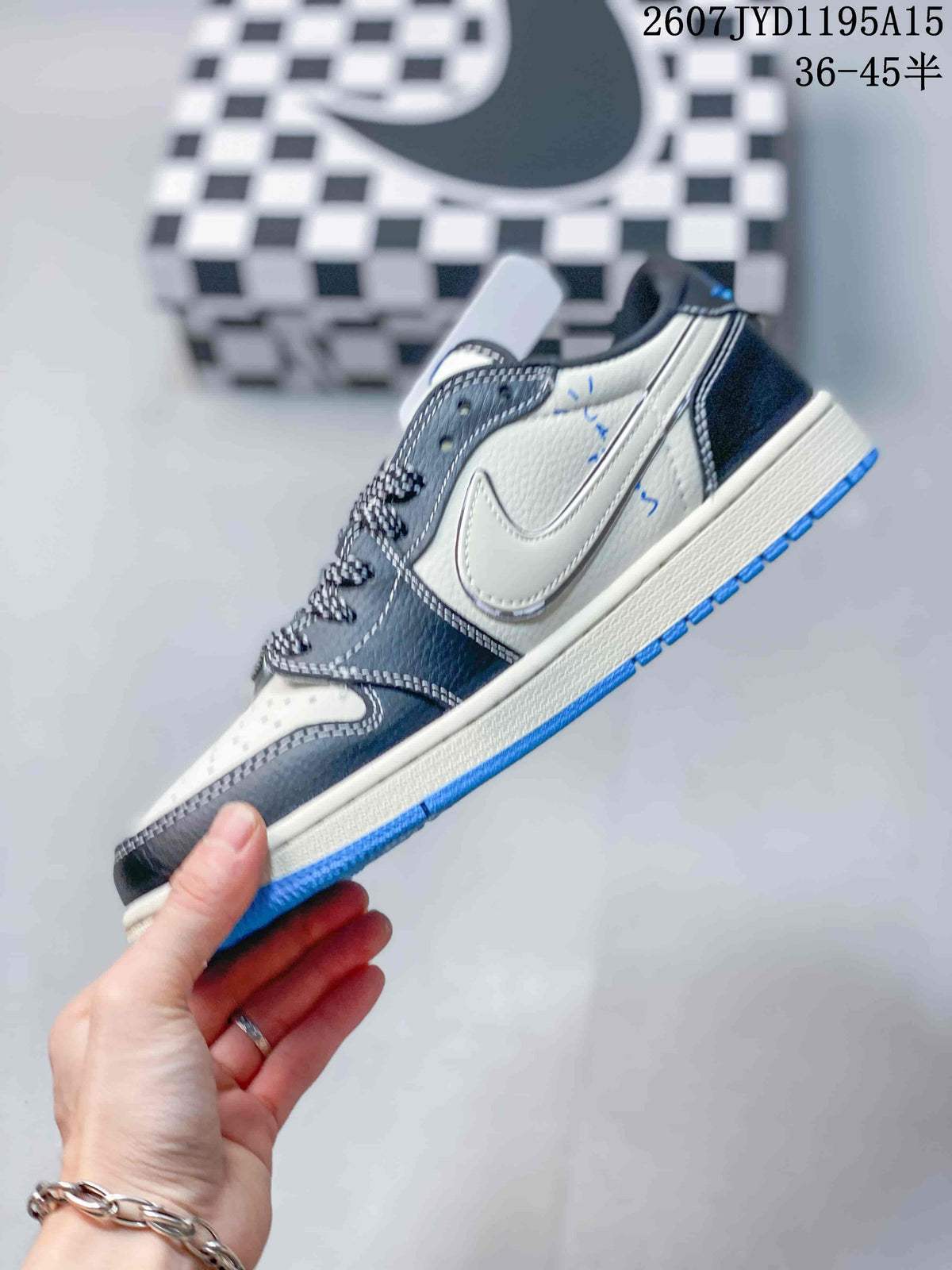 Side profile showing the white side panel, black overlays, blue outsole, and low-top construction.