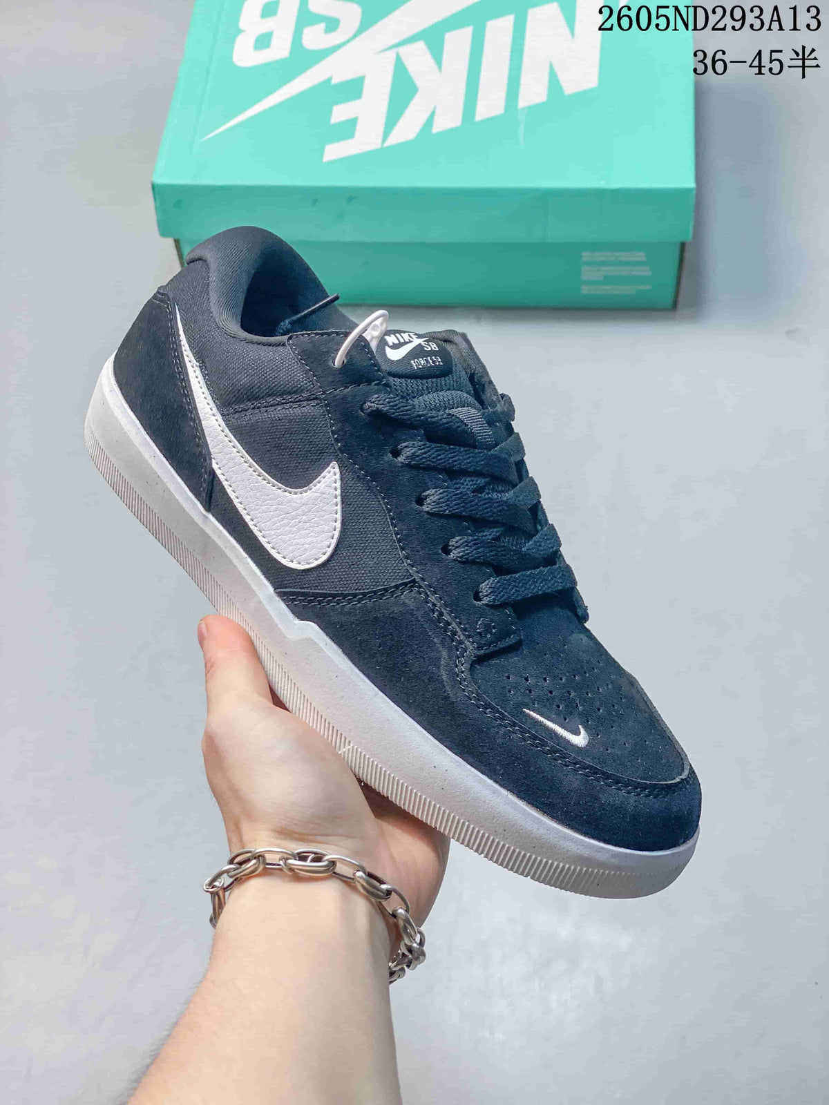 Dark navy Nike SB Force 58 low-top shoe with white side Swoosh and perforated toe.