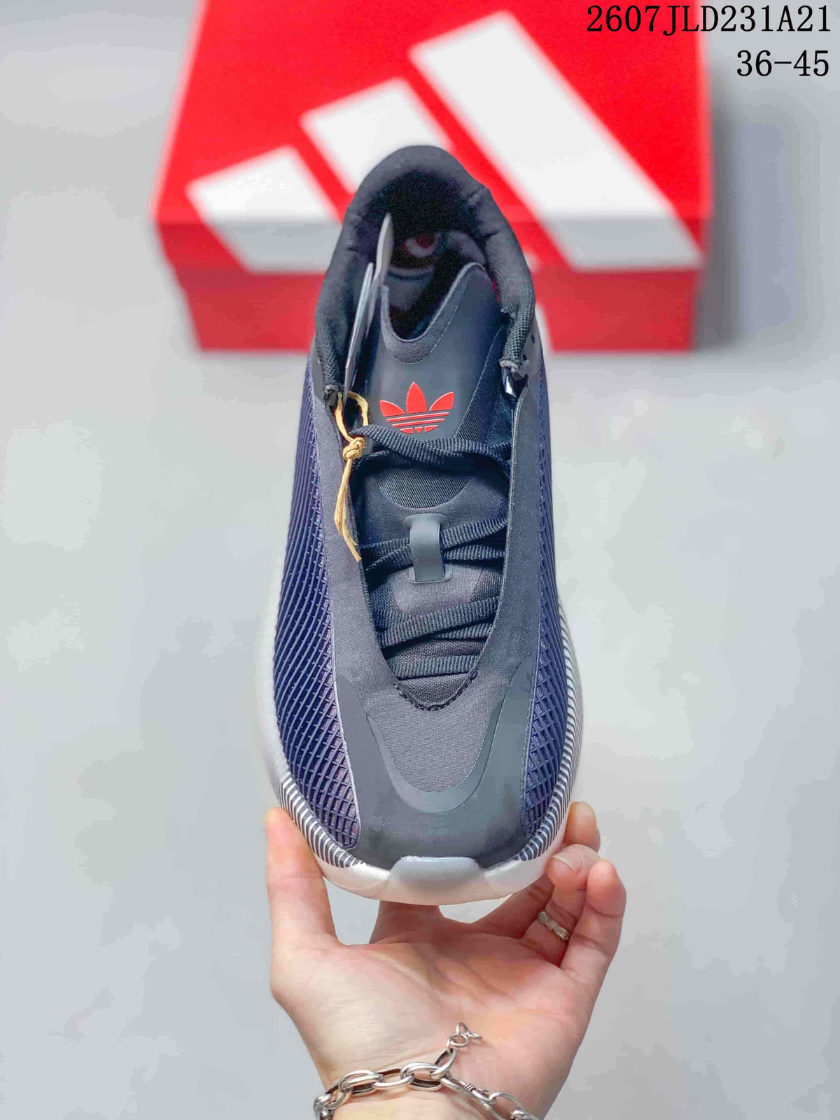 Top view showing the lace-up closure, layered tongue, and red trefoil branding.