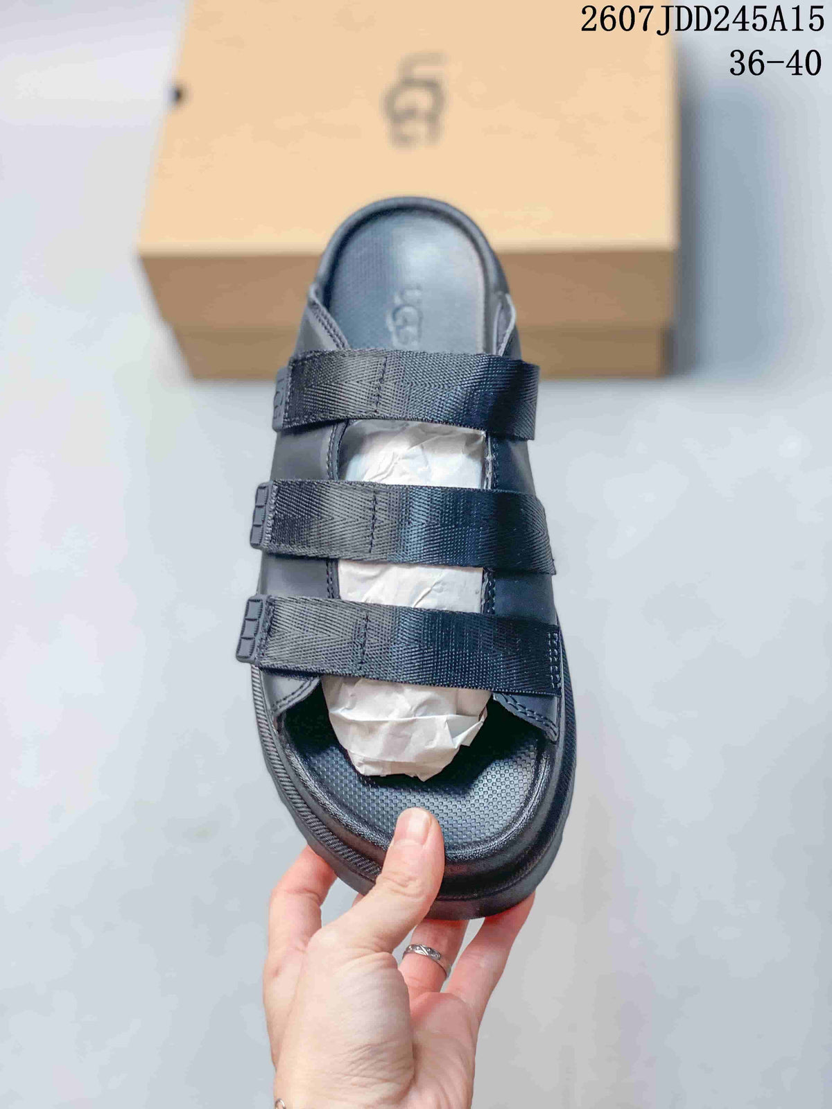 Top view of a black slide sandal showing three adjustable straps and the open-toe footbed.