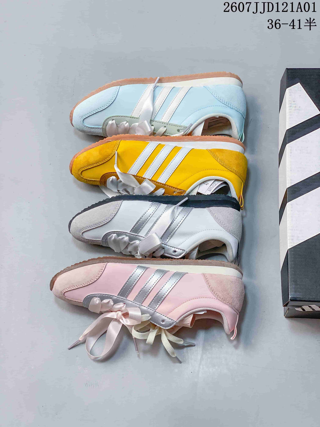 Four JOG 2.0 colorways shown from the side: pale blue, yellow, white and silver, and pink