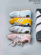 Four JOG 2.0 colorways shown from the side: pale blue, yellow, white and silver, and pink
