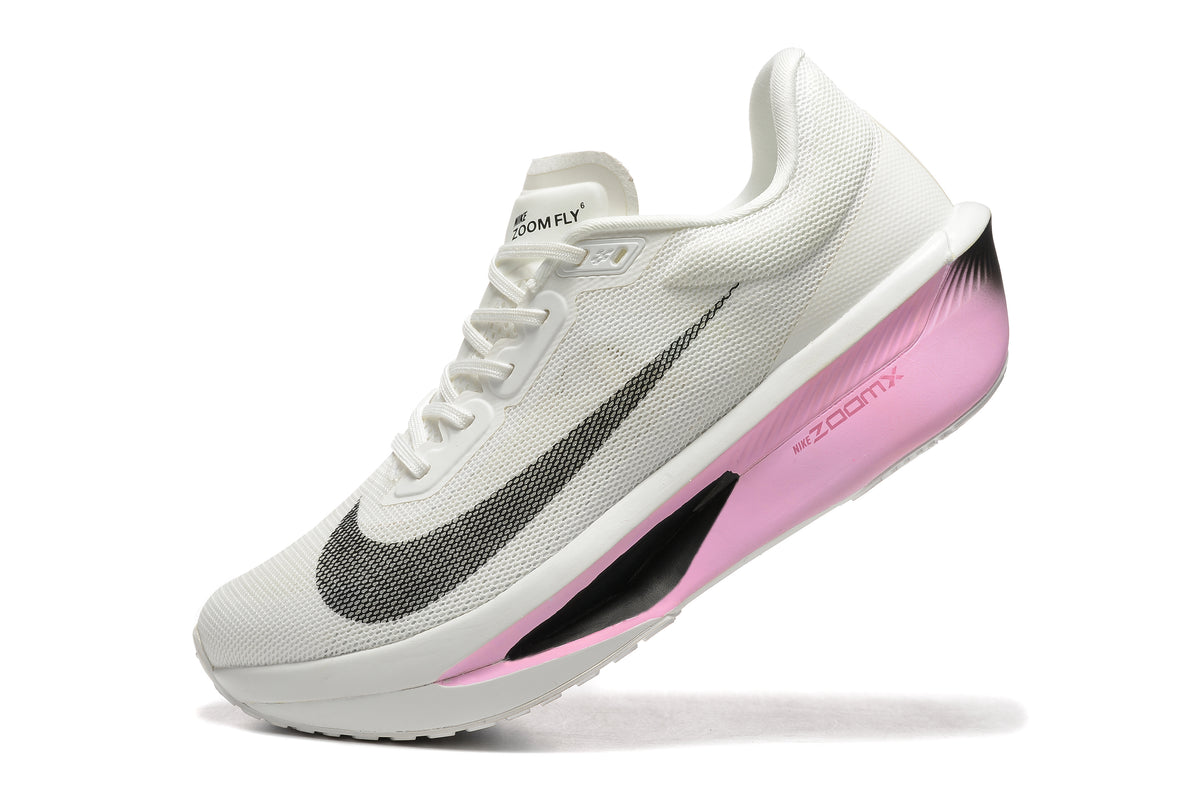 Close view of a white Nike Zoom Fly 6 shoe with pink midsole accents