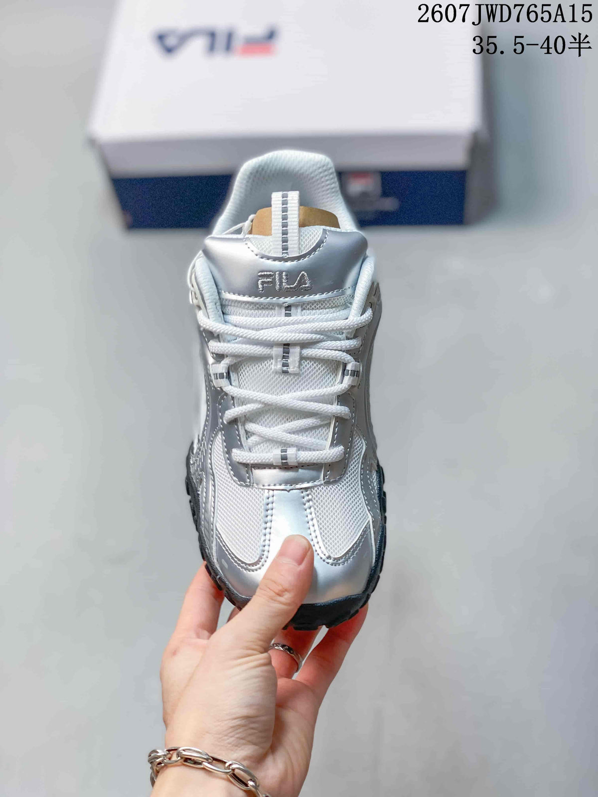 Front view showing the white laces, padded tongue and silver upper details.
