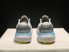 Rear view of the Brooks Glycerin 21 pair, showing grey heel panels, padded collars, blue heel accents, and white textured soles.