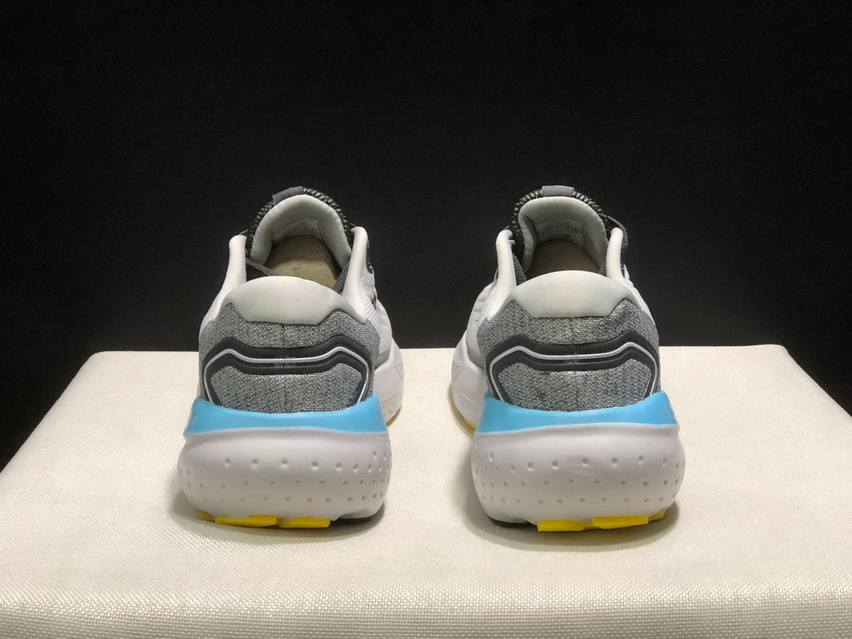 Rear view of the Brooks Glycerin 21 pair, showing grey heel panels, padded collars, blue heel accents, and white textured soles.