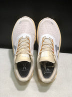 Top view showing the perforated upper panels, laces, tongues, and branded insoles.