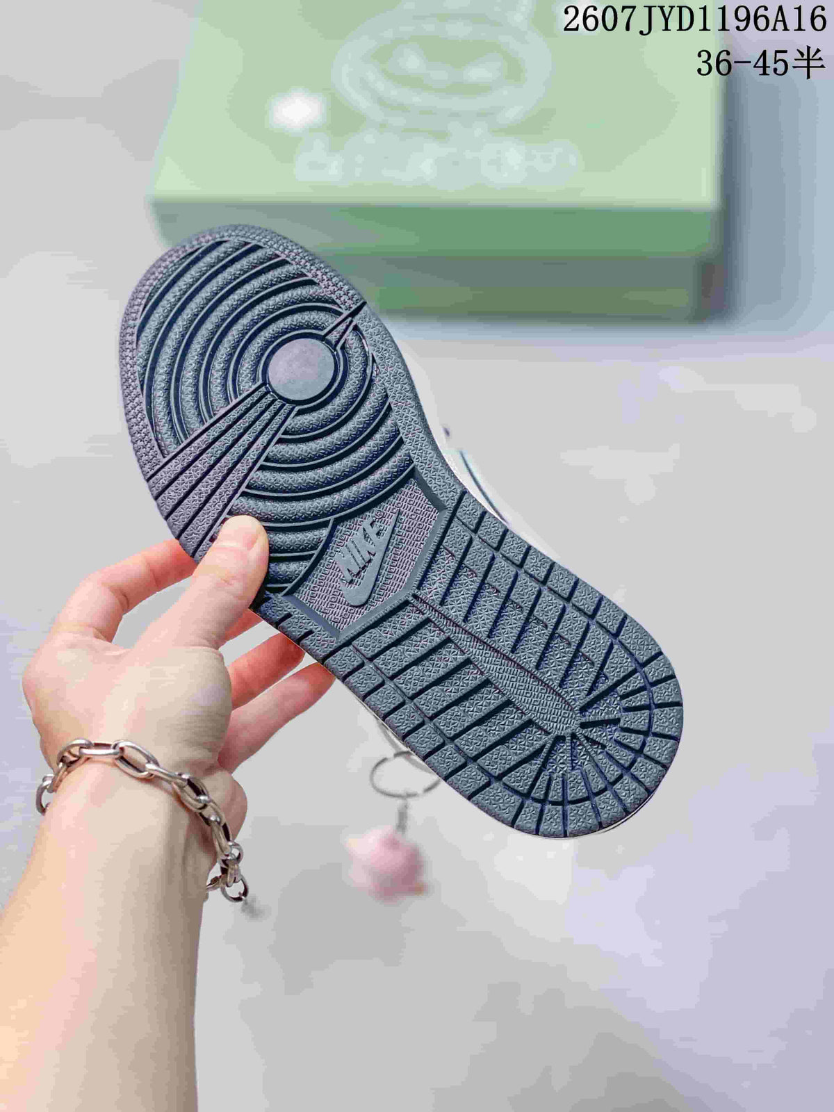 Close view of the patterned outsole with circular and geometric traction grooves.