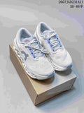 Pair of white and light blue On Cloudmonster 3 sneakers displayed on a shoebox.