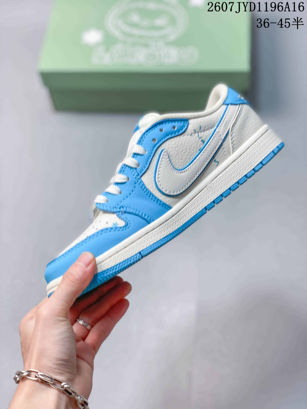 Side profile of the blue and white low-top sneaker showing the Swoosh, layered panels, and white midsole.