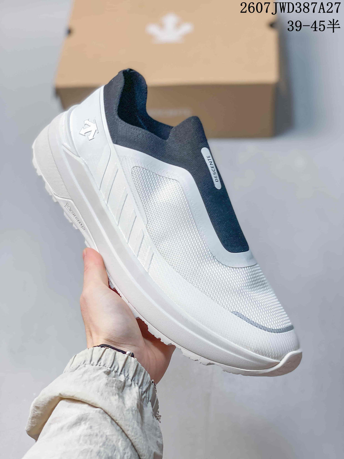 Angled side view of the white and navy Descente slip-on sneaker.