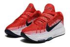 Pair of red and white Nike GT Hustle 3 basketball shoes with dark Swoosh accents.
