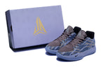 Pair of blue-gray patterned low-top basketball shoes beside a matching box