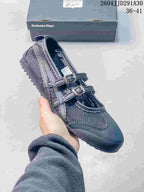 Dark navy sneaker shown from above with buckle straps