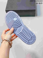 Close-up of the blue-gray patterned outsole of the Jordan 1 Low.