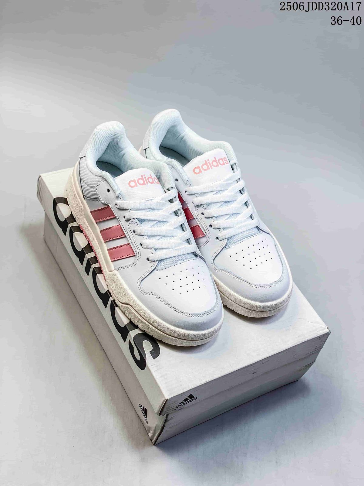 White and pink adidas Entrap sneakers displayed on an adidas shoebox, showing the front and side panels.