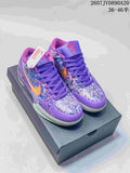 Pair of purple Nike Kobe 4 Protro basketball shoes displayed on a shoebox, showing the multicolor upper, yellow-orange Swoosh details and purple laces.