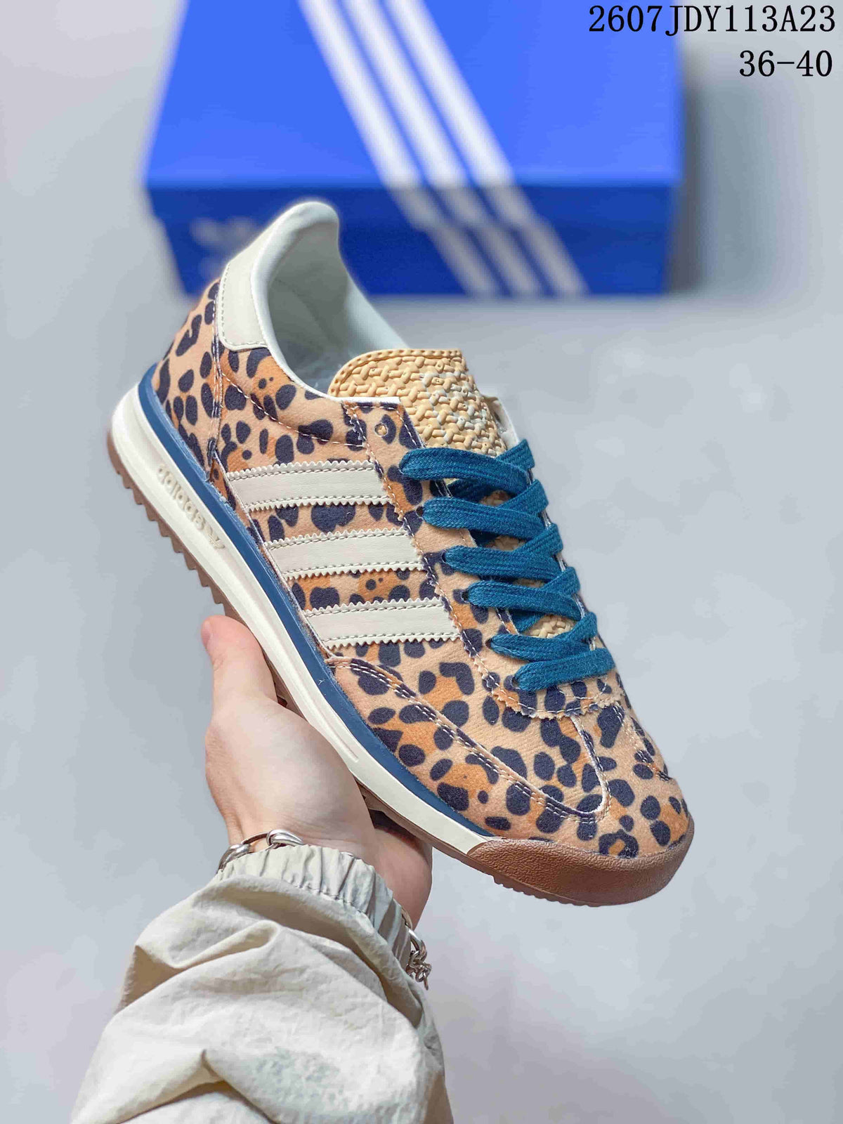 Leopard-print adidas SL 72 sneaker with blue laces, white side stripes and a gum-look outsole.
