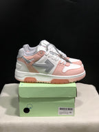 Side view of the white, pink and grey low-top sneakers showing the contrasting side panels and textured outsole.