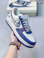 Angled side view highlighting the white and blue color blocking, Swoosh detail and Air branding.