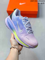 Angled side view showing the lavender textile upper, Nike Swoosh, black heel detail, and ZoomX marking.