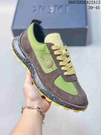 Three-quarter side view of the green and brown sneaker showing the textured overlays, side logo detail, speckled midsole, and yellow outsole.