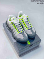 Pair of grey, black and neon green Nike Air Max 95-style sneakers displayed on a shoebox; image text shows JD974A24 and 40–46 sizing.
