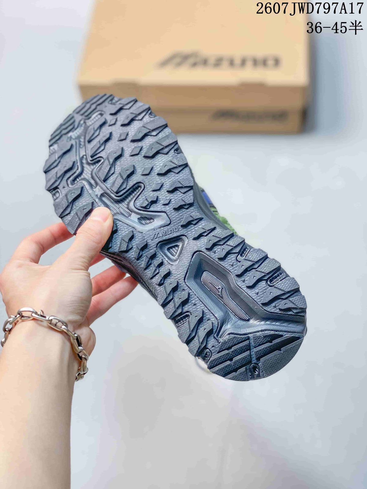 Close view of the sneaker outsole showing a rugged, deeply patterned tread.