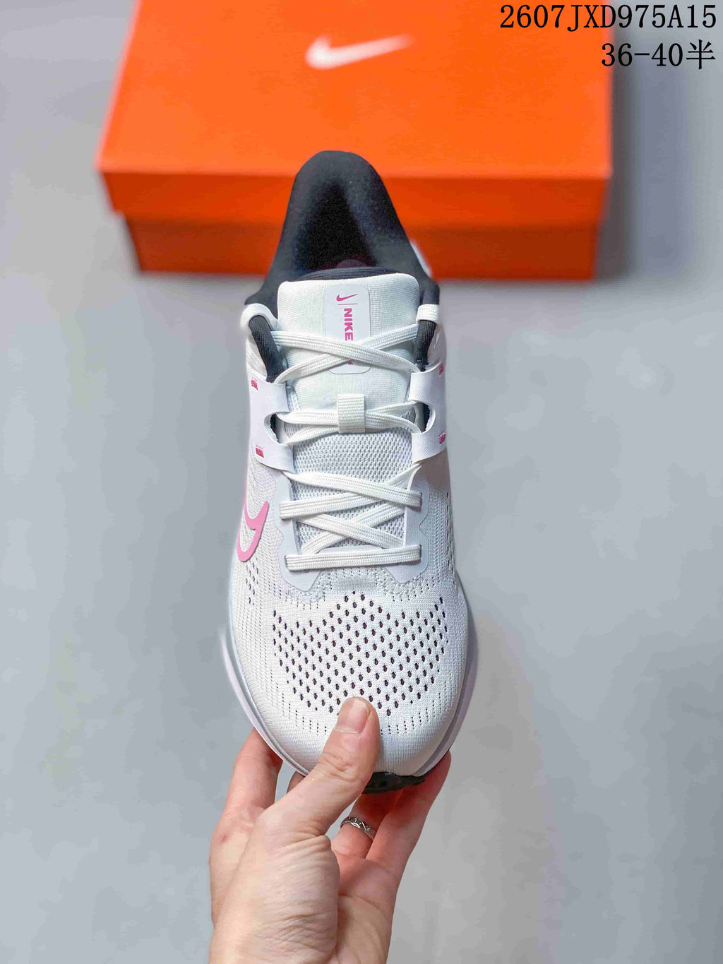 Top view showing the perforated white toe area, white laces and pink details.