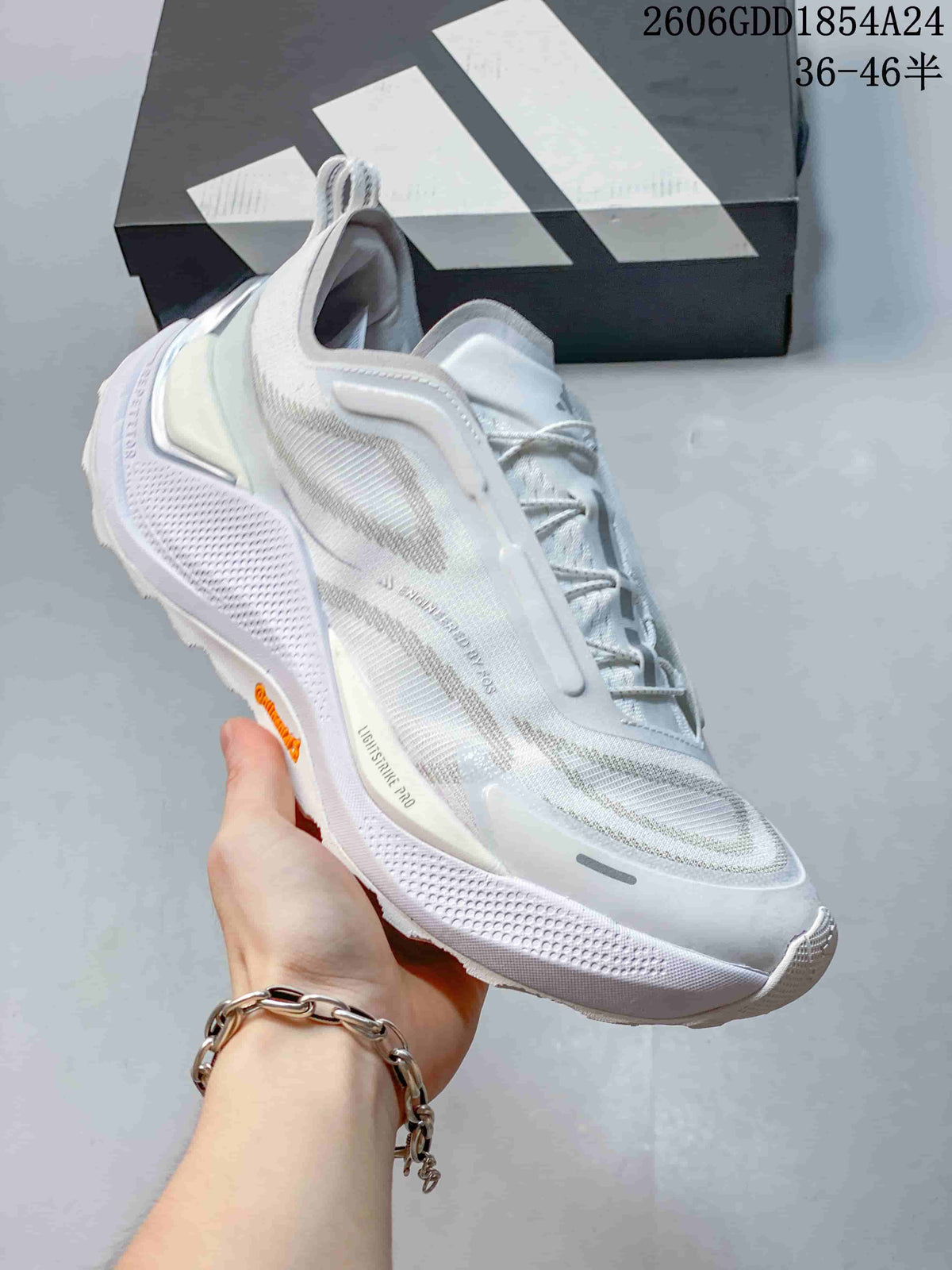Angled side view of a white and light-gray trail-running shoe