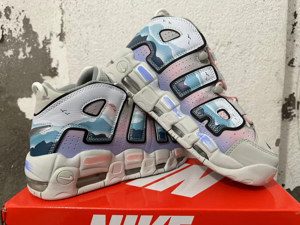 Pair of Nike Air More Uptempo sneakers showing the layered side design and chunky sole